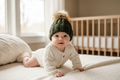 Dark olive baby beanie on clothed baby