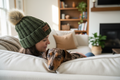 Dark olive NBPT beanie adult on couch with dapple dachshund