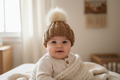 Toasted almond beanie on clothed baby